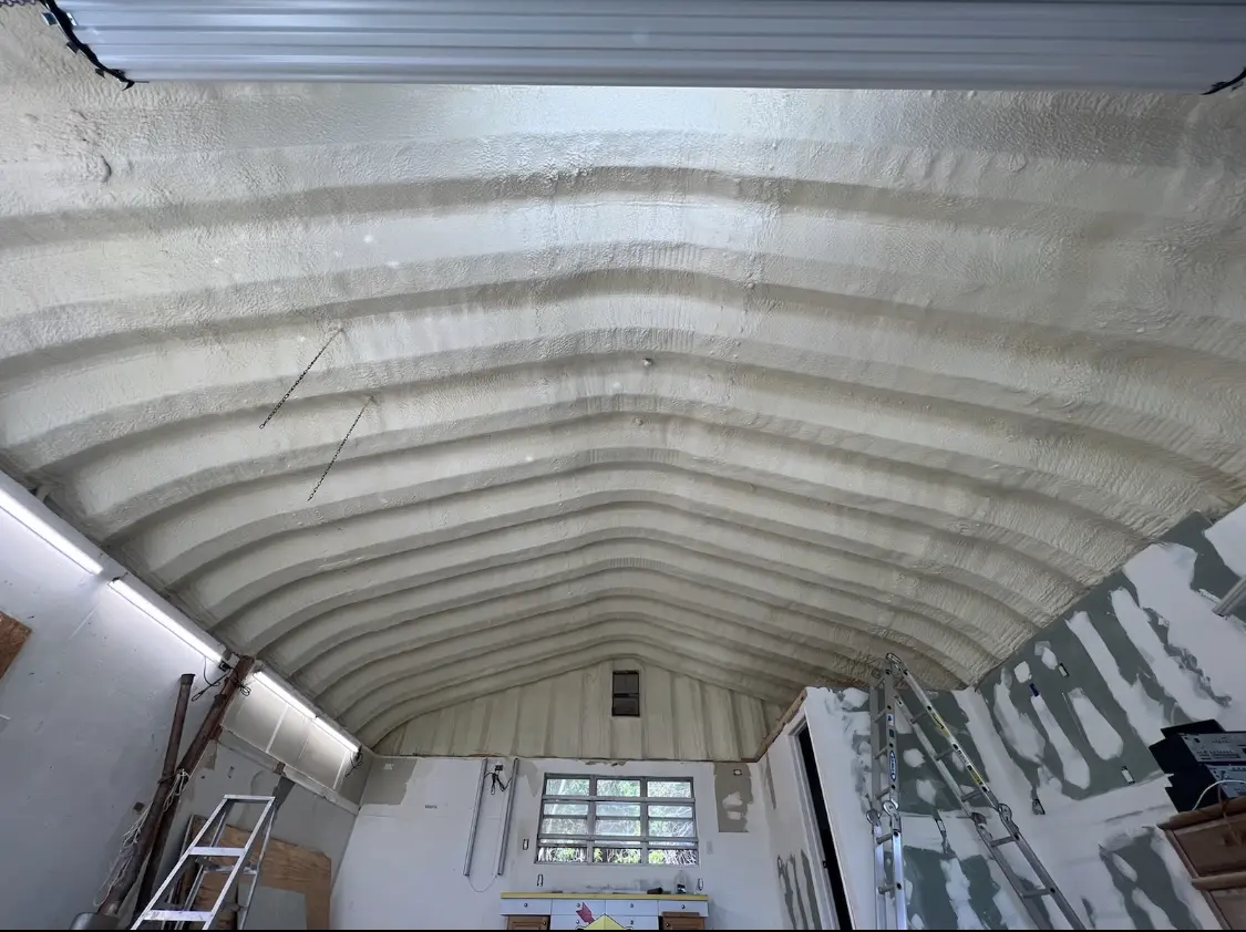 Spray polyurethane foam applied to the underside of a metal roof deck in Chelmsford